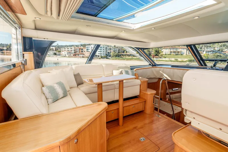 Slide: The Image of Luxurious interior of 2006 Tiara Yachts 5200 Sovran Salon with elegant seating and scenic views. - 13