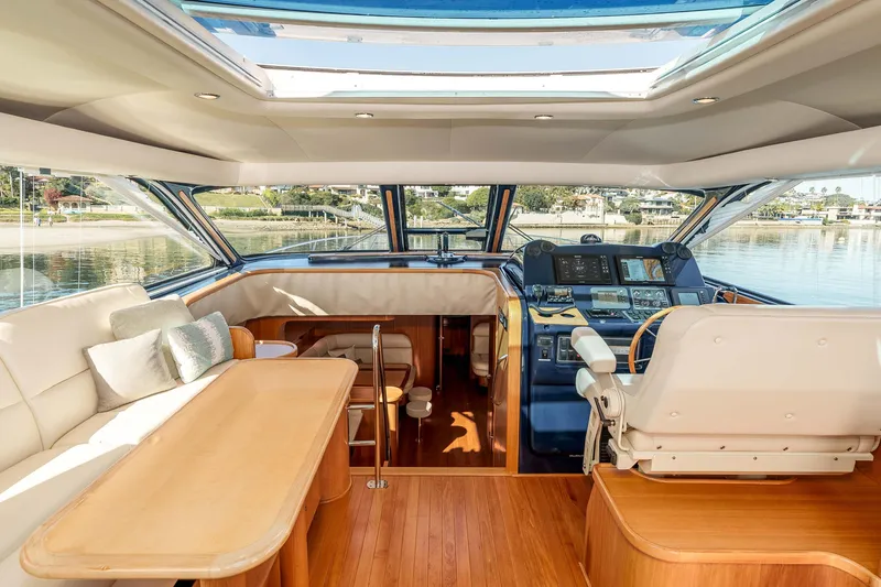 Slide: The Image of Luxurious 2006 Tiara Yachts 5200 Sovran Salon interior with helm and seating area. - 14