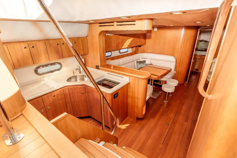 Slide: The Image of Luxurious 2006 Tiara Yachts 5200 Sovran Salon interior with wood finish and modern amenities. - 19
