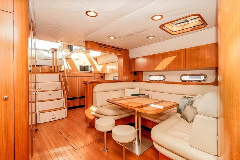 Slide: The Image of Luxurious interior of 2006 Tiara Yachts 5200 Sovran Salon with elegant wood finish. - 22