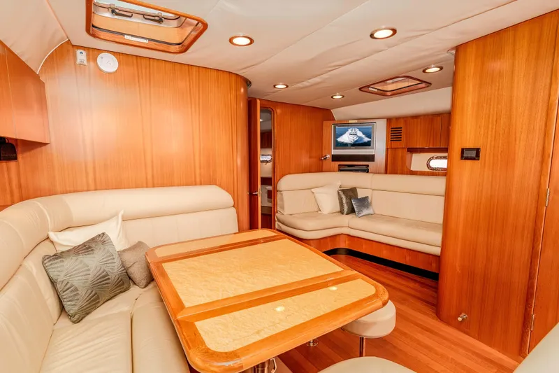 Slide: The Image of Luxurious 2006 Tiara Yachts 5200 Sovran Salon interior with elegant wood finish and plush seating. - 23