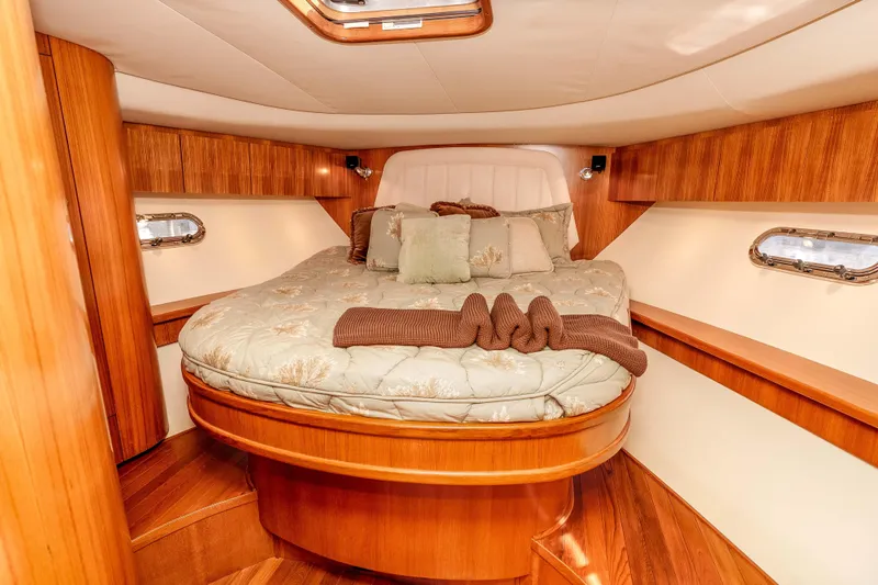 Slide: The Image of Luxurious 2006 Tiara Yachts 5200 Sovran Salon bedroom with elegant wood finish. - 24