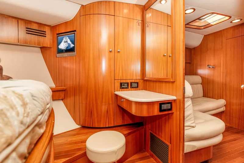 Slide: The Image of Luxurious 2006 Tiara Yachts 5200 Sovran Salon interior with wood paneling and seating. - 25