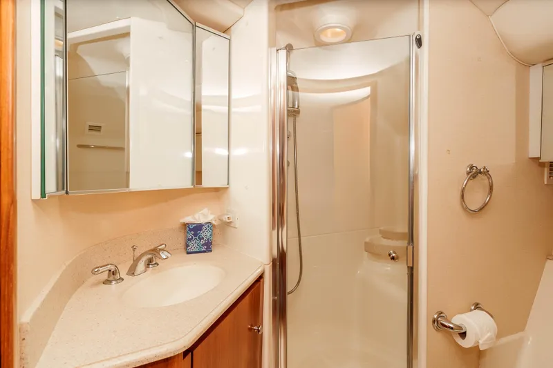 Slide: The Image of Luxurious bathroom in 2006 Tiara Yachts 5200 Sovran Salon with shower and vanity. - 28