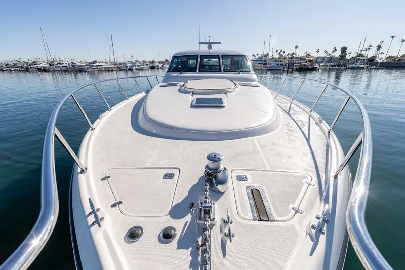 Slide: The Image of 2006 Tiara Yachts 5200 Sovran Salon yacht on calm water, marina background. - 38