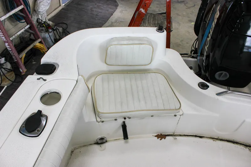 Slide: The Image of 2003 Trophy 1903 Center Console boat interior with seating and Mercury engine. - 10
