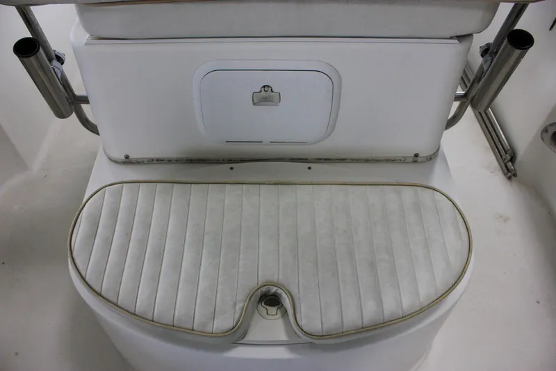 Slide: The Image of 2003 Trophy 1903 Center Console boat seat with storage compartment and rod holders. - 11