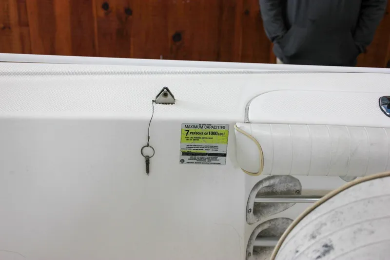 Slide: The Image of 2003 Trophy 1903 Center Console boat interior with capacity label and key. - 19