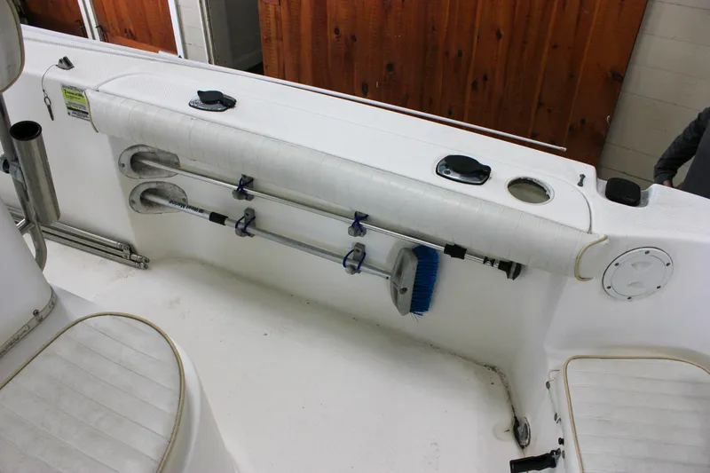 Slide: The Image of 2003 Trophy 1903 Center Console boat interior with storage and cleaning tools. - 20
