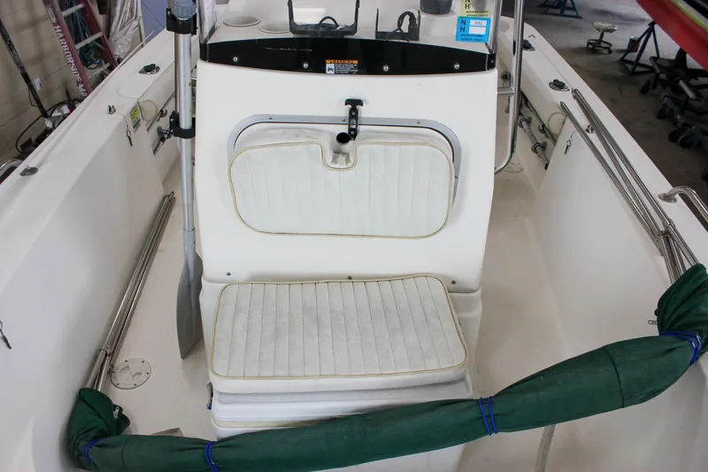 Slide: The Image of 2003 Trophy 1903 Center Console boat interior with white seating and equipment. - 23