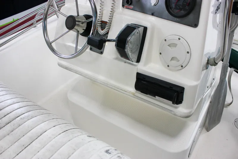 Slide: The Image of 2003 Trophy 1903 Center Console boat interior with steering wheel and controls. - 26