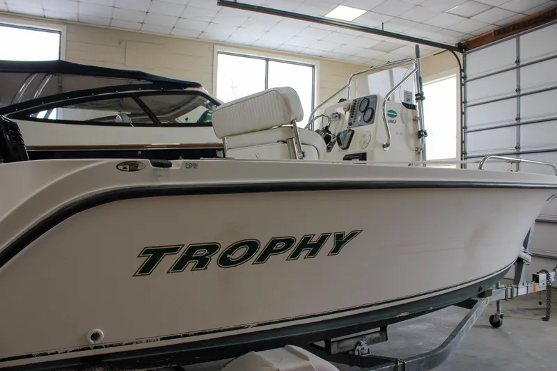 Slide: The Image of 2003 Trophy 1903 Center Console boat in indoor storage, side view. - 28