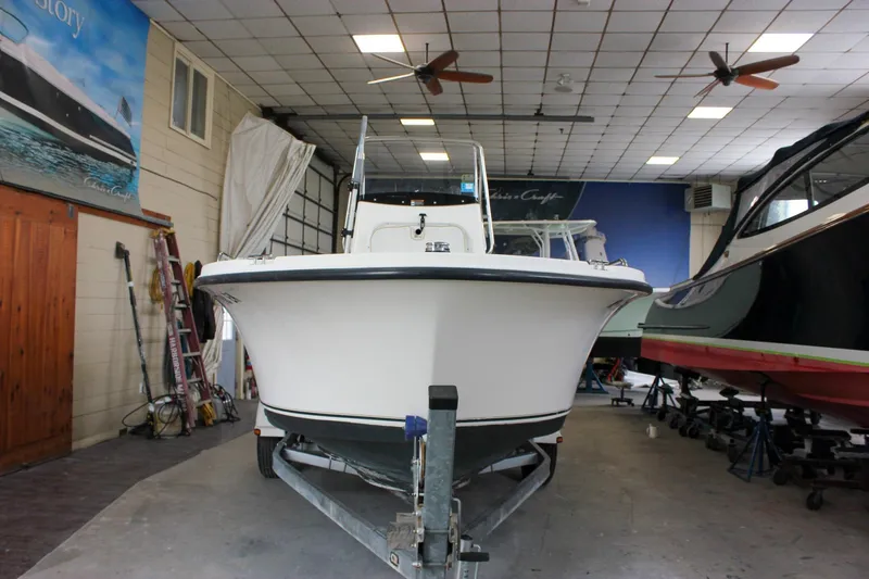 Slide: The Image of 2003 Trophy 1903 Center Console boat in indoor storage facility. - 3