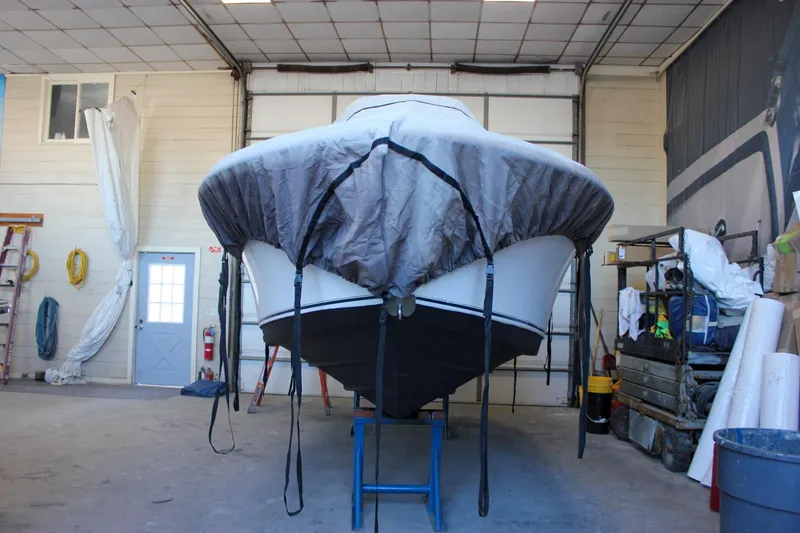 Slide: The Image of 2003 Trophy 1903 Center Console boat covered in a garage for storage. - 33