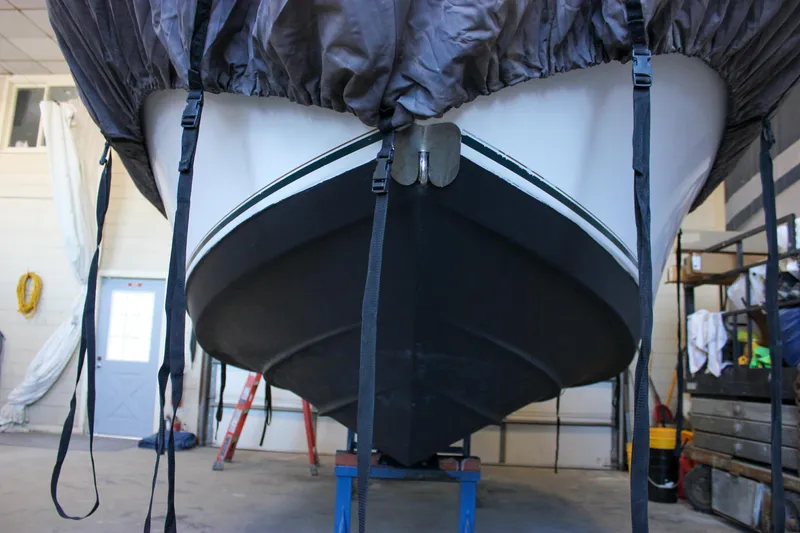 Slide: The Image of 2003 Trophy 1903 Center Console boat stored indoors, covered and secured with straps. - 34