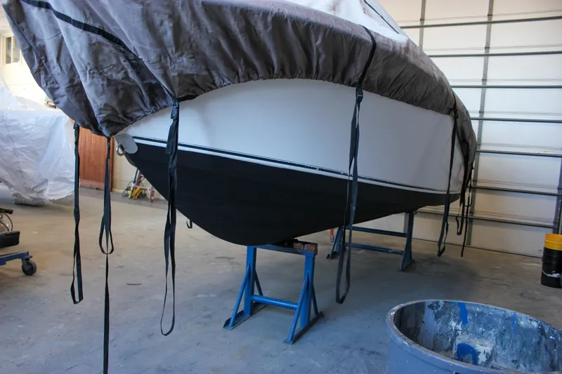 Slide: The Image of 2003 Trophy 1903 Center Console boat covered and elevated in a garage. - 35