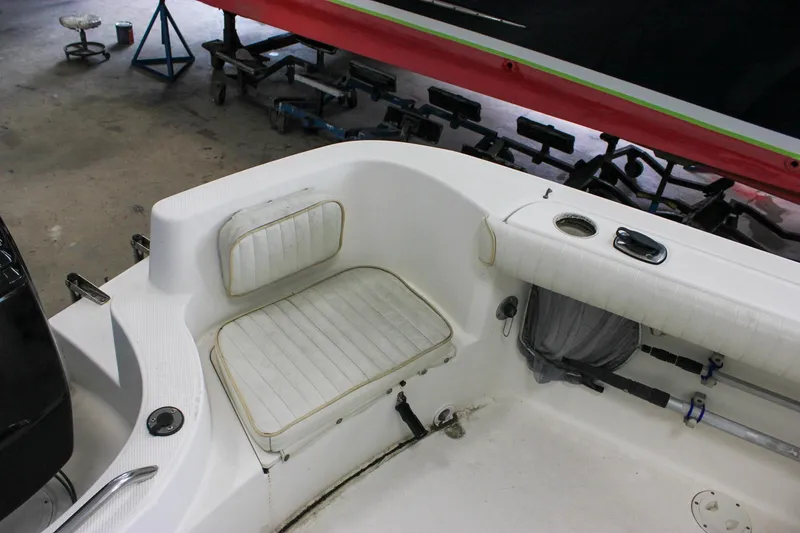 Slide: The Image of 2003 Trophy 1903 Center Console boat interior with seating and fishing rod holders. - 9