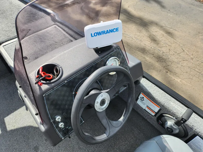 Slide: The Image of 2021 Tracker Bass Tracker Classic XL boat dashboard with Lowrance fish finder and steering wheel. - 11