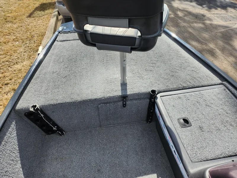 Slide: The Image of 2021 Tracker Bass Tracker Classic XL boat interior with gray carpet and seating. - 13