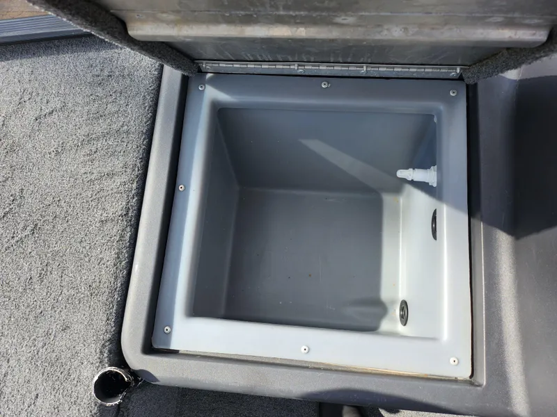 Slide: The Image of 2021 Tracker Bass Tracker Classic XL livewell compartment, open and empty. - 14