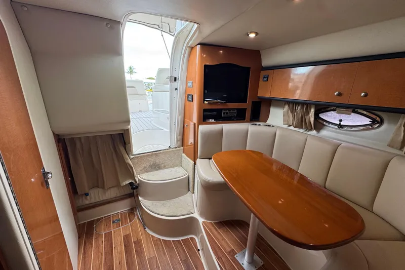 Slide: The Image of Interior of 2009 Chaparral Signature 290 yacht with seating, table, and entertainment area. - 15
