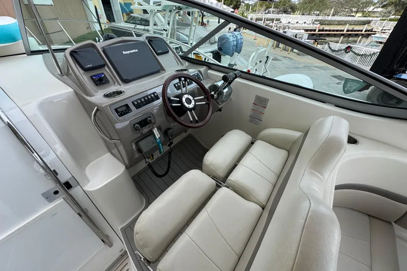 Slide: The Image of 2009 Chaparral Signature 290 boat cockpit with steering wheel and control panel. - 19