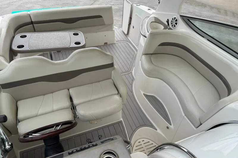 Slide: The Image of 2009 Chaparral Signature 290 boat interior with plush seating and table. - 20