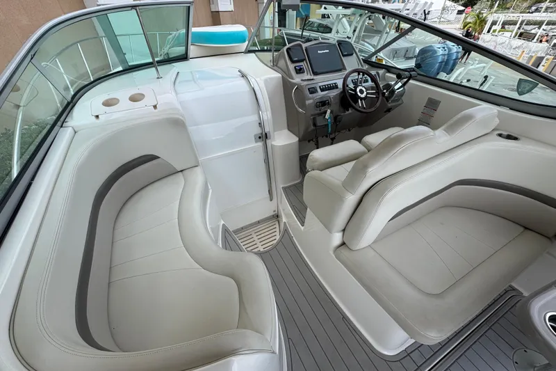 Slide: The Image of 2009 Chaparral Signature 290 boat interior with steering wheel and seating area. - 22