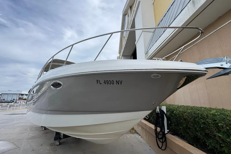 Slide: The Image of 2009 Chaparral Signature 290 boat docked, showcasing sleek design and modern features. - 4