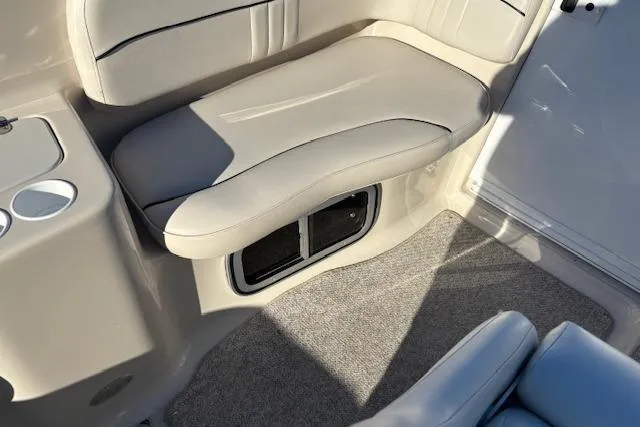 Slide: The Image of 2001 Crownline 242 CR boat interior with beige seating and carpeted floor. - 31