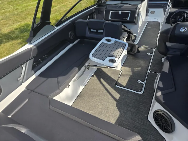 Slide: The Image of 2021 Scarab 285 ID boat interior with seating, table, and modern design. - 12