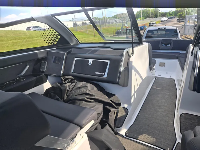 Slide: The Image of 2021 Scarab 285 ID boat interior with modern seating and dashboard design. - 15