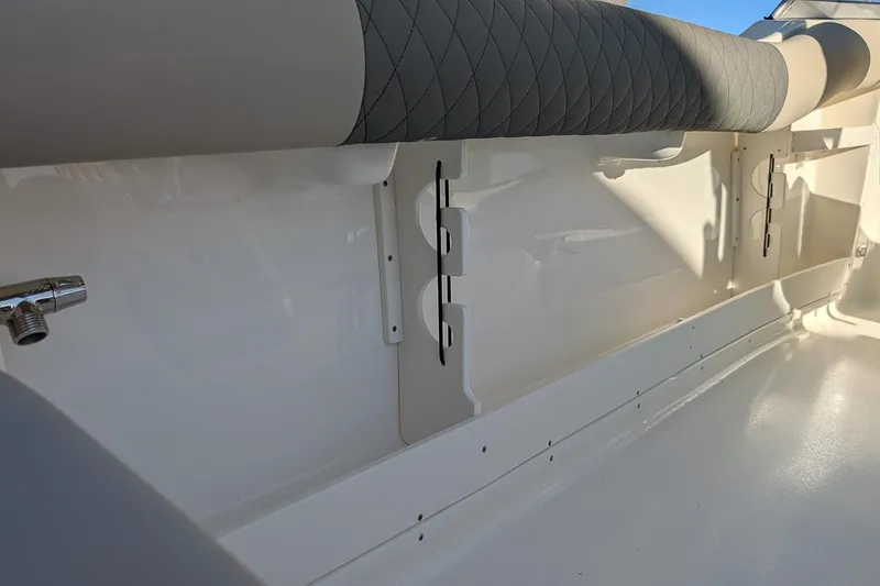 Slide: The Image of Interior view of 2026 Key West 239 DFS boat, featuring sleek seating and storage compartments. - 10