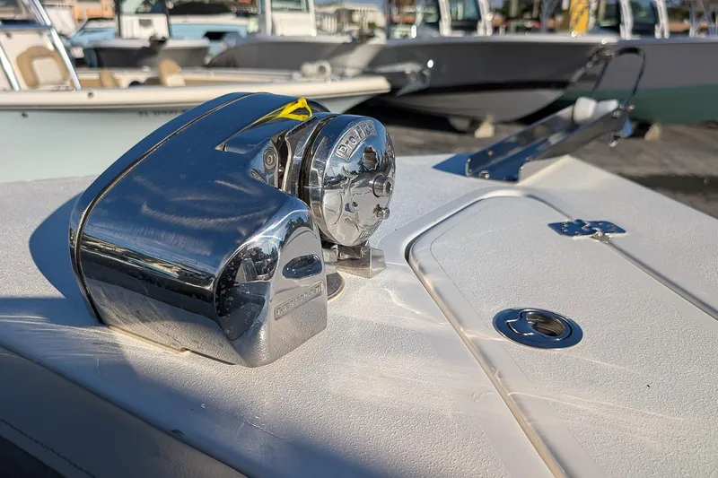 Slide: The Image of Close-up of a 2026 Key West 239 DFS boat's chrome anchor winch on deck. - 20