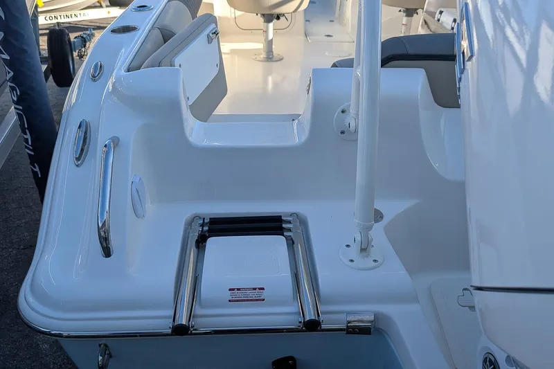 Slide: The Image of 2026 Key West 239 DFS boat interior with seating and stainless steel details. - 6