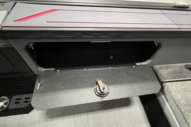 Slide: The Image of 2025 Alumacraft Trophy 175X Sport storage compartment with open lid and latch. - 15