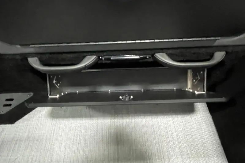 Slide: The Image of 2025 Alumacraft Trophy 175X Sport interior storage compartment detail. - 16