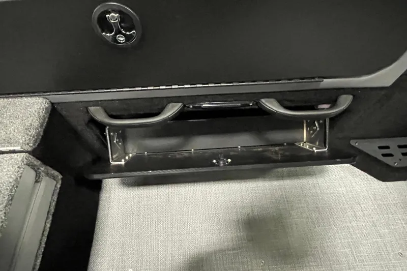 Slide: The Image of 2025 Alumacraft Trophy 175X Sport interior storage compartment with handles and latch. - 18