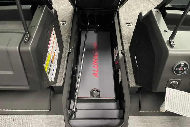 Slide: The Image of 2025 Alumacraft Trophy 175X Sport interior storage compartment with branding visible. - 7