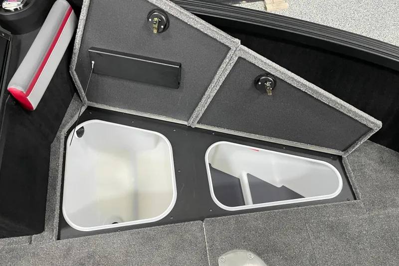 Slide: The Image of 2025 Alumacraft Trophy 175X Sport boat storage compartments with open lids. - 8