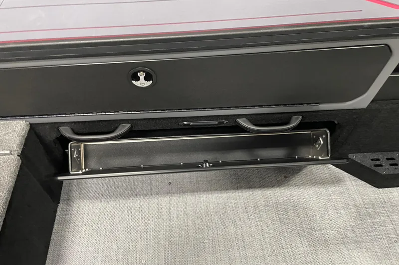 Slide: The Image of 2025 Alumacraft Trophy 185X Sport storage compartment with open drawer and sleek design. - 14