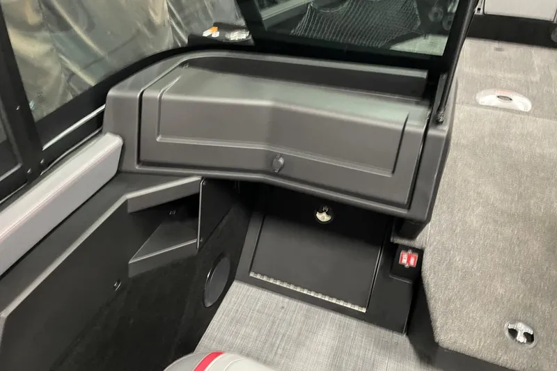 Slide: The Image of Interior of 2025 Alumacraft Trophy 185X Sport boat, featuring storage compartments and seating. - 15