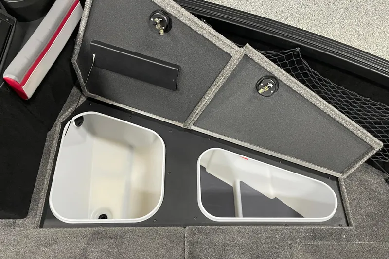 Slide: The Image of 2025 Alumacraft Trophy 185X Sport boat storage compartments with secure locks and organized layout. - 6