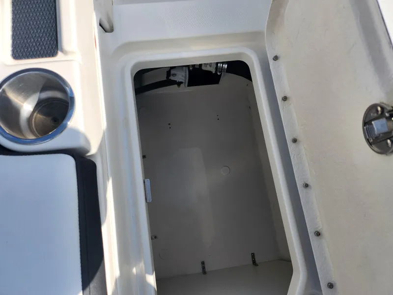 Slide: The Image of Open storage compartment on 2021 Bayliner DX 2000 boat. - 12