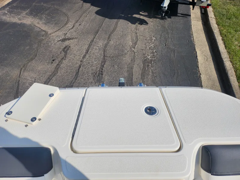 Slide: The Image of Bayliner DX 2000 boat deck, 2021 model, parked on asphalt road. - 18