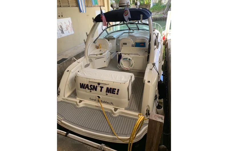 Slide: The Image of 2006 Sea Ray 340 Sundancer docked, rear view with "Wasn't Me!" nameplate, Coral Gables, FL. - 3