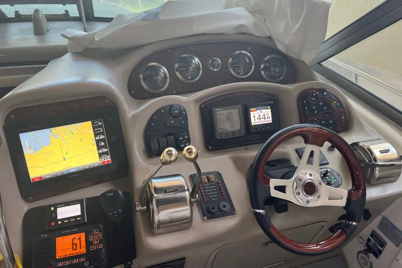 Slide: The Image of Control panel of a 2006 Sea Ray 340 Sundancer boat with navigation equipment. - 4