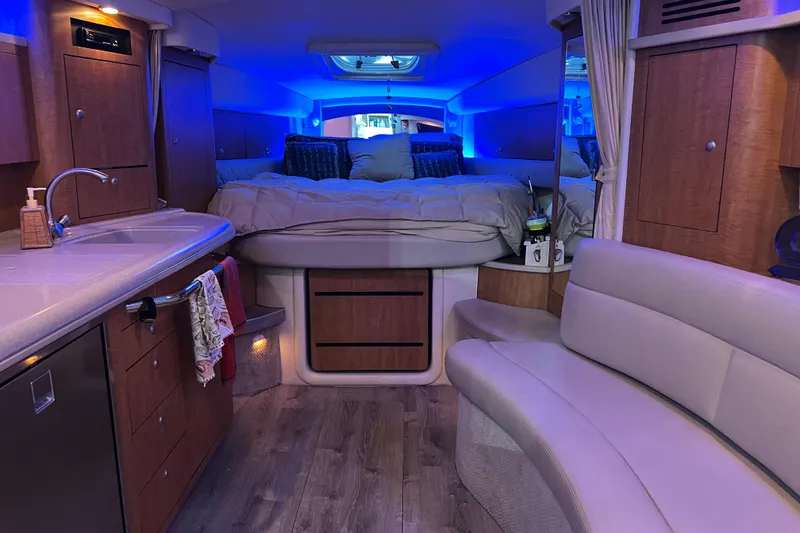 Slide: The Image of Luxurious 2006 Sea Ray 340 Sundancer cabin with modern amenities and ambient lighting. - 8