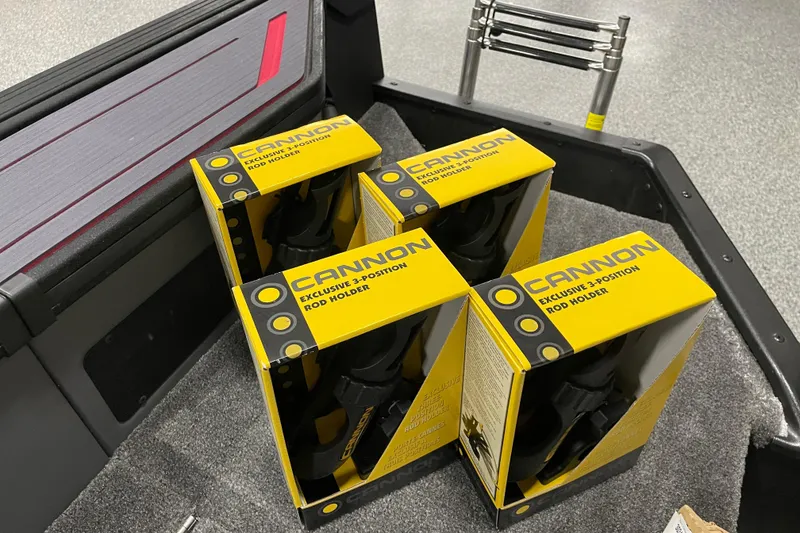 Slide: The Image of Boxes of Cannon rod holders on a 2025 Alumacraft Trophy 185X Sport boat. - 14