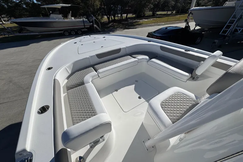 Slide: The Image of 2026 Caymas 281 HB boat interior with cushioned seating and sleek design. - 22